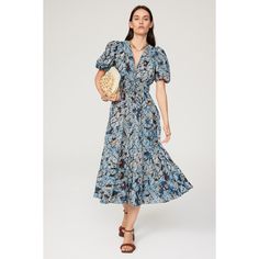 Blue floral cotton blend (70% Cotton, 30% Viscose). A-line. Short sleeves. V-neck. Pull on. 48" from shoulder to hemline. Imported. Blue Floral V-neck Dress For Daywear, Floral Print V-neck Sundress Midi Dress, Floral Print V-neck Midi Sundress, Bohemian Midi Dress With Surplice Neckline And Floral Print, Flowy Floral Print Knee-length V-neck Dress, Flowy Floral Print V-neck Knee-length Dress, Flowy Knee-length V-neck Floral Dress, Chic Floral Print Midi Dress With Surplice Neckline, Chic Midi Dress With Surplice Neckline And Floral Print