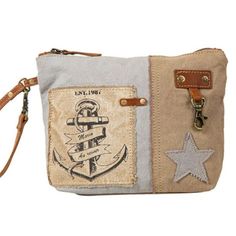 This Delightful Bag, With Its Charming Mariner Theme, Has A Wonderfully Textured, Rich Design. It Features Patchwork-Type Accents Of Canvas And Leather, A Worded Label, And A Sewn Star. Zipper-Close Top, Matching Canvas Back, And Durable Leather Wristlet Carrying Strap. Very Fun! View Less More Information Materials Canvas & Leather Item Width 10 Item Depth 2 Item Height 7.5 Handle 5.5 Beige Leather Handle Clutch For Everyday Use, Beige Clutch With Leather Handles For Everyday Use, Everyday Beige Clutch With Leather Handles, Large Capacity Beige Pouch For Everyday Use, Beige Shoulder Bag Cosmetic Bag For Everyday Use, Beige Clutch Cosmetic Bag For Everyday Use, Beige Shoulder Cosmetic Bag For Everyday Use, Everyday Large Capacity Pouch Clutch, Large Capacity Pouch Clutch For Everyday Use