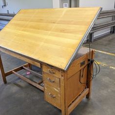 a wooden workbench with two drawers on each side