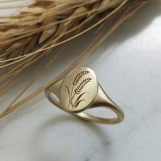 Elegant and unique 14k gold wheat signet ring, Vintage style botanical signet. * Band width: 1.6 mm, wide part width: 12 mm * Thickness: 1.6 mm * Available in 14K or 18K YELLOW, WHITE and ROSE gold. The price listed is for 14K please contact me for 18K pricing. * Sizes vary from 5 US to 9 US, including half sizes. Please choose your size upon checkout. * Please choose a finish: Shiny or Matte, and mention in note to seller. * This item is handmade, please allow 3-4 weeks of processing before shi Wheat Ring, Unique Gold Wedding Rings, Valentines For Her, Fine Gold Jewelry, Gold Color Ring, Ring Flower, Knuckle Ring, Braided Ring, Silver Signet Ring