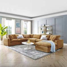 a living room filled with furniture on top of a hard wood floor