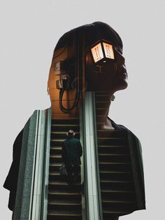 a man standing on an escalator with his head in the air