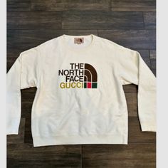 Cln Gucci X The North Face Authentic N Brand New - Sweatshirt Sz Medium Condition: Pre-Owned Condition. See Measurements. Measurements: Chest 25 In 63.5 Cm Length 27.5 In 69.8 Cm Measurement Armpit 2 Armpit: 25" Length: 27.5" Condition: Pre Owned Condition. This Is The Photos Of The Actual Item You Will Receive. Please Examine The Photos Carefully As They Are Part Of The Description. I Want You To Be Happy With Your Purchase And Since Sizes Vary So Much, Please Go By The True Measurements Listed Designer Winter Tops With Logo Print, Designer Logo Print Tops For Winter, Designer Tops With Logo Print For Winter, Designer Letter Print Tops For Winter, Designer Logo Print Sweatshirt For Fall, Designer White Sweatshirt For Fall, Designer Crew Neck Tops For Fall, Designer Embroidered Logo Tops For Fall, Designer Long Sleeve Tops With Logo Print