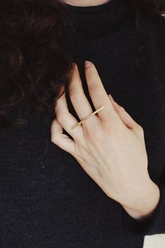 Subtle yet powerful, this ring is a favorite. An elegant yet easy piece for versatile wear, this ring is comfortable and delicate while remaining sturdy and bold looking. A hand shaped brass bar lays partly across three fingers wile a sterling band secures it in place. The ring looks great on its own or paired with stackers. The bar measures about 40 mm across.Choose a plain finish or stamped brass bar.This piece is made to order in your size, please allow 2-3 weeks to create before shipping (ti Modern Brass Midi Rings, Minimalist Brass Midi Rings For Everyday Wear, Minimalist Brass Midi Rings For Everyday, Everyday Minimalist Brass Midi Rings, Minimalist Brass Stackable Rings, Everyday Brass Midi Rings, Minimalist Everyday Stackable Brass Rings, Everyday Brass Midi Rings With Open Design, Brass Midi Rings For Everyday