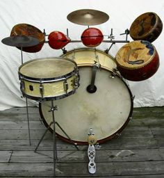 a close up of a drum set on a wooden floor