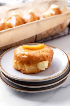 there is a plate with some food on it next to a tray of pastries