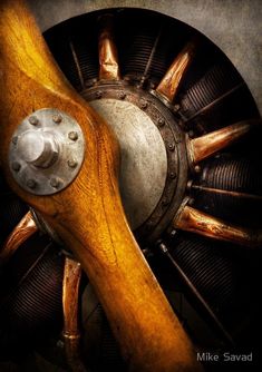 an airplane propeller with wood and metal parts