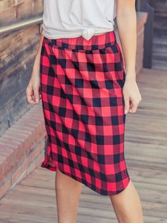 Looking for a weekend skirt that's both cozy and stylish? Look no further than our Buffalo Plaid Weekend Skirt! This skirt is the perfect combination of cute and comfortable, with a knee-length cut and a self-tie waistband that'll keep you feeling feminine and put-together all day long. Whether you're running errands or meeting up with friends for brunch, this skirt is sure to turn heads. And with sizing options ranging from S to 3X, it's easy to find the perfect fit for your body type.So why wa Fall Daywear Skirted Bottoms, Midi Skirt For Daywear In Fall, Casual Cotton Pencil Skirt For Day Out, Casual Winter Loungewear Skirt, Casual Skirt With Elastic Waistband For Daywear, Casual Mini Skirt For Fall, Casual Mini Skirt For Daywear, Casual Fall Midi Skirt, Casual Pleated Skirt For Fall