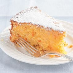 a piece of cake with powdered sugar on top is sitting on a white plate