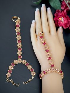 This is an Exquisite and versatile jewelry piece: the Polki Bracelet and Ring Combo, a mesmerizing fusion of tradition and elegance. This set beautifully combines the charm of a Haathphool, a Finger Bracelet, and a Ring Bracelet to create a stunning Hand Harness that will captivate admirers and elevate your style to new heights. Crafted with intricate precision, each piece showcases a delicate arrangement of Polki gemstones, renowned for their radiant sparkle and timeless appeal. The Haathphool gracefully adorns your hand, connecting to an intricately designed Finger Bracelet that accentuates the grace of your fingers. The accompanying Ring Bracelet adds a touch of regal allure, completing the ensemble in perfect harmony. Whether you're dressing up for a wedding celebration, a formal event Indian Hand Jewelry, Finger Ring Bracelet, Polki Bracelet, Ring Combo, Bracelet Combo, Victorian Bracelet, Finger Bracelets, Hand Harness, Bracelet And Ring