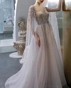 Elegant Long Sleeve Kaftan For Banquets, White Embellished Dress With Cape Sleeves, White Embellished Long Dresses, Elegant Floor-length Kaftan For Banquet, Elegant Floor-length Kaftan For Banquets, Evening Dresses With Sweep Train And Cape Sleeves, White Long Train Dress For Banquet, Evening Dress With Cape, Tulle Applique