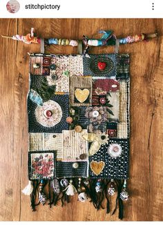 a wall hanging made out of fabric and buttons