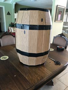 a large wooden barrel sitting on top of a table