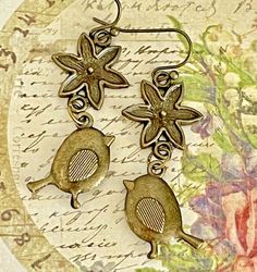 Bronze Sweet Bird and Flower Dangle Earrings. Nature. Spring. Enjoy~ *purchase multiple items and save on shipping!!! 2+ pair = $3.98 shipping 5+ pair = FREE shipping Please visit my store to check out all of my items: http://stores.ebay.com/LOVEbeadsboutique Vintage Dangle Earrings For Spring, Whimsical Nickel Free Dangle Flower Earrings, Whimsical Gold Flower Earrings, Handmade Vintage Earrings For Spring, Vintage Gold Flower Earrings For Spring, Gold Vintage Flower Earrings For Spring, Vintage Spring Jewelry Nickel Free, Vintage Nickel-free Jewelry For Spring, Vintage Flower Charm Dangle Earrings