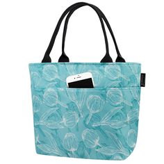 a blue bag with flowers on it and a cell phone in the front pocket,