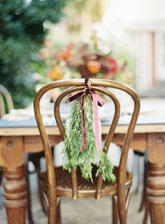 a wooden chair with a pink ribbon tied to it's back and the words 5 ways to decorate with garland