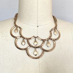 Vintage bib festoon style necklace. Ornate filigree designs make up the 3 fan shaped pendants. Antique/vintage spring ring closure.  Total length 16" Necklace drop 7.5" Material: unknown, metal alloy. Possibly brass and/or coin silver with gold wash. Non magnetic. Excellent wearable, condition, no repairs breakage or corrosion. Could use some polishing here and there. Please review our store policy's before purchasing. Festoon Necklace, Jewelry Hand, Vintage Spring, Gold Wash, Bohemian Necklace, Filigree Design, Gold Gold, Necklace Gold, Spring Rings