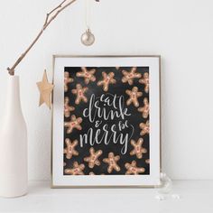 a black and gold christmas card with gingerbreads in the shape of stars on it