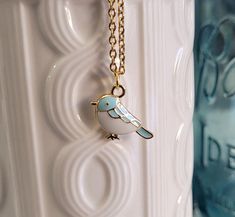 This cute bird necklace would make a great gift.  The bird is 14k gold plated with white and blue enamel. The chain is a gold color stainless steel and you can choose the length of the necklace. This would make a great gift for a birthday, an anniversary, Christmas or any other occasion. All jewelry items come in a gift box. Wood Guest Book, Christmas Blue, Memory Locket, Mom Wedding, Bird Necklace, Cute Birds, Necklace Gift, Wedding Bridesmaids, Blue Bird