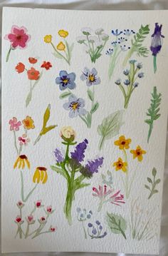 watercolor painting of flowers on white paper