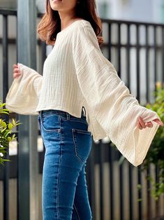 Sizes S-M  Bust  38" Front length 16" Back length 20"  Long sleeve 24" L-XL Bust 44" Front length 16" Back length 20"  Long sleeve 24" Model is 5′2″ (158cm) tall with a 81cm/32″ bust, 69cm/27″ waist, 92cm/36″ hips Important Notice Regarding Product Color Variations We strive to provide the most accurate and high-quality images of our products to enable you to shop with confidence. However, we would like to remind you that despite our best efforts, there may be slight variations in color between the images you see online and the product you receive. Please consider the following points: 1. **Photography Limitations The colors of our products as shown on our website, social media platforms, or promotional materials may vary slightly from the actual items. This discrepancy can be due to the l Oversized Summer Tops With Lantern Sleeves, Oversized Lantern Sleeve Tops For Summer, Long Sleeve Cotton Blouse For Fall, Spring V-neck Top With Unlined Sleeves, Chic Long Sleeve Cotton Blouse, Oversized Tops With Blouson Sleeves For Summer, Fall Day Out Top With Blouson Sleeves, Oversized Blouson Sleeve Tops For Summer, Fall Blouson Sleeves Top For Day Out