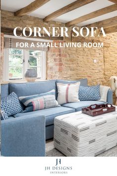 the corner sofa for a small living room is in blue and white with pillows on it