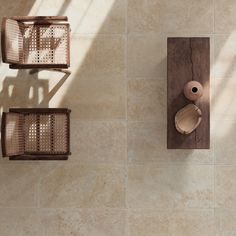 two wooden baskets on the wall next to each other