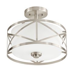 a semi flush ceiling light fixture with an etched glass shade on the top and bottom