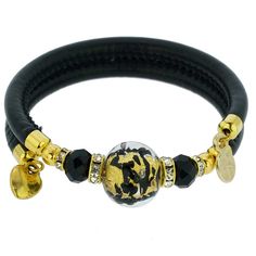 Adorn your wrist with this lovely Murano Glass bracelet - a fine token of Venice with its glamour, elegance, and charm. A high-quality textured black leather band complements a stunning 24K gold-lined finely crafted Murano Glass bead in the center. This Venetian bracelet is handmade in a small Murano Glass workshop in Venice, Italy by experienced artisans who use only basic tools to shape glass beads under a small flame, as was the Venetian custom for a thousand years. This radiant Murano bracel Adjustable Gold Leather Chic Bracelet, Adjustable Gold Leather Bracelet Chic Style, Elegant Leather Bracelet For Party, Chic Gold Jewelry With Leather Strap, Luxury Gold Leather Bracelet Adjustable, Luxury Gold Leather Bracelet With Adjustable Fit, Luxury Gold Adjustable Leather Bracelet, Modern Gold Jewelry With Leather Strap, Elegant Gold Leather Bracelet For Formal Occasions