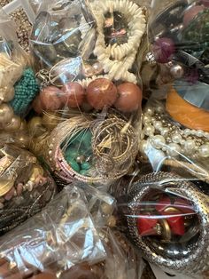 a pile of assorted jewelry sitting on top of a table