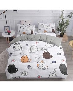 a bed with many cats on it in a room next to a potted plant