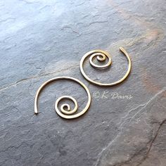 Small 14k gold filled spiral hoop earrings. Petite AND make a statement: win- win! Formed and cold forged from 20 gauge 14k gold filled wire into this small coil. The ends have been sanded for comfort in wearing, then polished to a light shine. * Small spiral hoop earrings are approximately 17mm in diameter. Please see measurement photo. You can also choose sterling silver at the dropdown to the right. If you are looking for the larger version of this style click here: https://www.etsy.com/listi Gold Spiral Wire Wrapped Hoop Earrings, Handmade Minimalist Spiral Hoop Earrings, Gold Minimalist Spiral Wrap Earrings, Minimalist Gold Spiral Wrap Earrings, Swirl Shaped Nickel-free Hoop Earrings As Gift, Swirl Hoop Earrings Nickel Free Gift, Nickel-free Swirl Hoop Earrings Gift, Gold Spiral Hoop Earrings Nickel-free, Gold Spiral Hoop Earrings Nickel Free