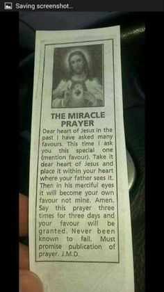 a person holding up a paper with an image of jesus on it and the words,'the miracle dear heart of jesus in the past