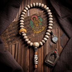 "Embark on a journey of mindfulness with 36-Bead Bodhi Seed Mala, a symbolic circle of serenity inspired by Tibetan Buddhist traditions. Each Bodhi seed bead represents a step towards enlightenment, while the meticulously knotted Tibetan Agate on a durable rope adds both strength and spiritual depth to this meditation accessory.  * Beads Material: Bodhi seed (Daemonorops Margaritae seed)   * Main Bead: Tibetan Agate   * Accessories: Silver Letters   * Process: Handmade (Up to five days)   * Package: Eco envelop Daemonorops Margaritae seeds, cherished in Tibetan Buddhism, symbolize spiritual evolution with their natural luster and enduring resilience, embodying the cyclical nature of enlightenment. Also, The \"Five Eyes\" represent natural divisions or facets on the surface of the seed, res Agate Accessories, Tibetan Prayer Beads, Tibetan Mala, Horn Ring, Meditation Accessories, Buddhist Traditions, Accessories Silver, Tibetan Buddhism, Tibetan Buddhist