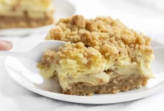 a close up of a plate of food on a table with a fork in it