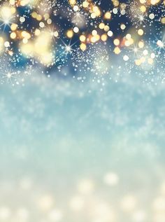 a blurry background with snow flakes and stars