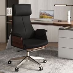 an office chair sitting in front of a desk with a laptop computer on top of it