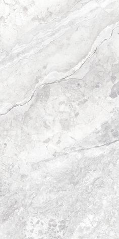 a white marble textured surface with grey veiners