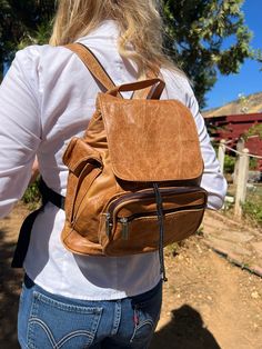 "Backpack bag,Brown leather backpack,Made in Mexico,Back pack,sling bag Beautiful Brown Leather backpack Made in Mexico Perfect condition Adjustable strap, straps can also be zipped up to be used as a sling. Bag is fully lined with a cinch top and flap over and snap closure. Bag has 2 front zip pocket 1 side Velcro close pocket and one long side zip pocket. Measures: 11\" x 11.5\" x 4\" 191 197 Backpack bag,Brown leather backpack,Made in Mexico,Back pack,sling bag" Brown Leather Backpack With Zipper For Daily Use, Brown Rectangular Backpack With Zipper Pocket, Brown Leather Satchel Backpack With Zipper, Brown Leather Rectangular Backpack With Zipper Pocket, Brown Rectangular Leather Backpack With Zipper, School Backpack With Zipper Pocket In Brown, Brown School Backpack With Zipper Pocket, Casual Brown Leather Backpack For Daily Use, Casual Brown Leather Backpack With Zipper