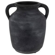 an old black vase is shown on a white background