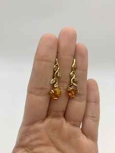 Gold Amber Earrings set with Natural Amber in a top grade & brownish-yellow translucent resin, at 10x8mm each (6 Ct a pair).Gold Vermeil: 18k Gold over Solid 925 Sterling Silver ☞ made to last.Click here for ☞ Matching RingClick here for ☞ Matching PendantDetails:• Natural Amber in a top grade & a stunning honey color• Amber: 10x8mm, 6 Ct a pair, cabochon cut• Lever Back Closure - "English Lock"• Dimensions: Length 30mm, Width 10mm• 18k Gold Vermeil❀ Each Natural Gem is unique & will have Slight Amber Citrine Teardrop Earrings, Amber Citrine Earrings With Ear Wire, Orange Pierced Earrings For Formal Occasions, Formal Orange Pierced Earrings, Yellow Citrine Earrings For Formal Occasions, Elegant Single Amber Earring, Formal Yellow Citrine Earrings, Orange Formal Earrings, Amber Drop Earrings With Ear Wire