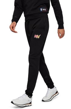 It's easy to rep your favorite team in the stands or on the streets in logo-marked sweatpants made for comfort from a soft, stretchy cotton blend. 83% cotton, 14% polyester, 3% elastane Machine wash, line dry Made in Turkey Athleisure Sports Bottoms With Logo Detail, Black Sportswear Pants For Sports Events, Casual Sports Bottoms With Logo Detail, Black Athleisure Pants For Sports Events, Black Cotton Sweatpants For Sports Season, Casual Black Bottoms With Logo Detail, Black Casual Pants For Sports Events, Black Logo Bottoms For Sports, Athleisure Joggers With Logo Detail For Sports