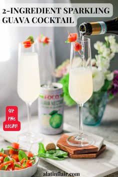 two glasses filled with white wine and garnish next to a bowl of vegetables