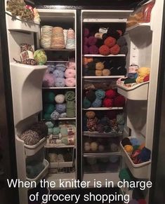 an open refrigerator filled with lots of yarn and crochet balls on the shelves