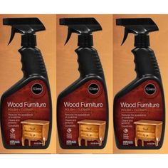 three bottles of wood furniture cleaner