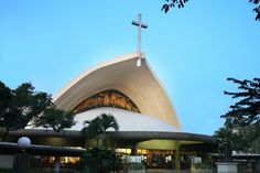 a large church with a cross on the top