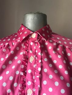 "Adorable, super cute 60s Vintage polka dot blouse in shocking pink coloring, polka dot pattern and ruffled button up row Short sleeves, classic collars and lovely pleated back. This shirt smells 60s by far and it's so cute and such a girly garment Original 60s unique blouse in a great vintage condition, ideal for pin up, rock n roll and psycobilly styled gals Just matched it with your fitted denim! ‼️Be aware! Only one garment is available---- 🌀MEASUREMENTS: (Garment is Lying flat, when button Retro Pink Collared Tops, Pink Retro Shirt With Buttons, 1960s Shirts Women, Vintage Pink Shirt With Button Closure, Vintage Pink Button-up Blouse, Pink Coloring, Cupro Fabric, Shocking Pink, Loose Shirt