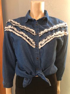 "Cute shirt. Love it tied over a sundress. Light Chambray denim. 3/4 length sleeves. Great condition. Medium Length 24\" Shoulders 28\" Sleeves 29\" Bust 39\" Waist 38\"" Denim Top With Frayed Hem For Fall Day Out, Long Sleeve Dark Wash Denim Top With Frayed Hem, Cotton Denim Top With Frayed Hem For Day Out, Dark Wash Long Sleeve Top With Frayed Hem, Casual Spring Blouse With Frayed Hem, Casual Long Sleeve Blouse With Frayed Hem, Long Sleeve Denim Top For Summer Day Out, Spring Button-up Denim Top With Frayed Hem, Casual Cotton Blouse With Frayed Hem