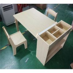 a wooden table and chair with drawers on it