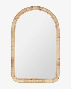 an oval mirror made out of rattan with a wooden frame on the top and bottom